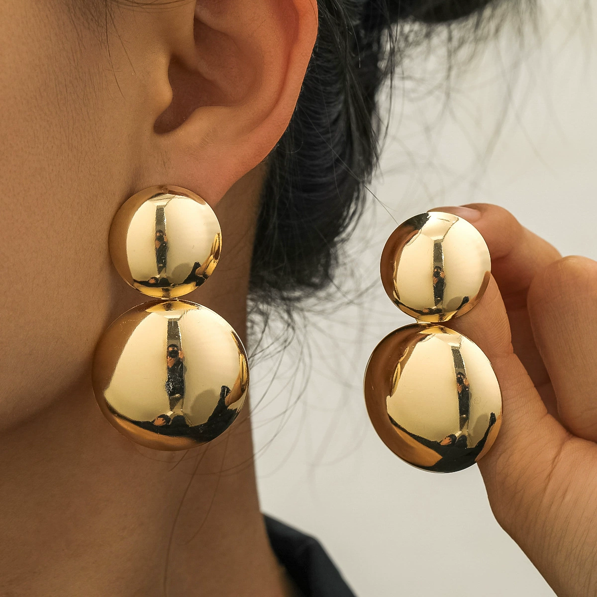 Glossy spherical metal earrings